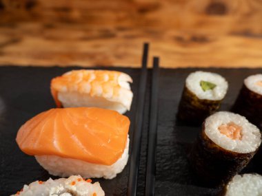 Japanese kitchen. Sushi on a dark background. Sushi close up.