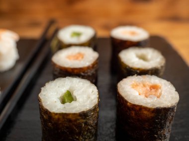 Japanese kitchen. Sushi on a dark background. Sushi close up.