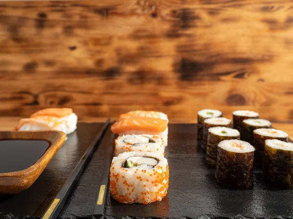 Japanese kitchen. Sushi on a dark background. Sushi close up.