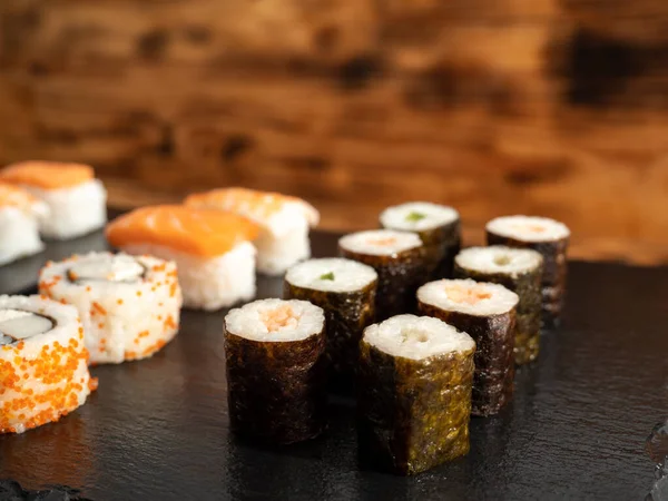 Japanese kitchen. Sushi on a dark background. Sushi close up.