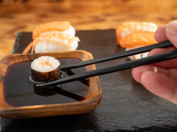 Japanese kitchen. Sushi on a dark background. Sushi close up.