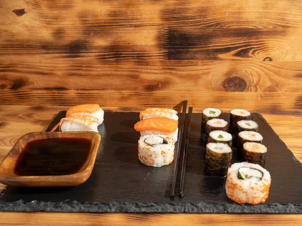 Japanese kitchen. Sushi on a dark background. Sushi close up.