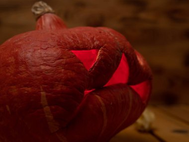 Pumpkin on a wooden background. Halloween pumpkin. Close-up.