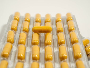 Medicines. Capsules in blister packs. yellow capsules. Close-up.