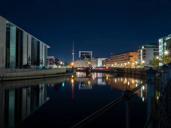 stock image Central district at night, Berlin. Reflection of the city in the river. Night city.