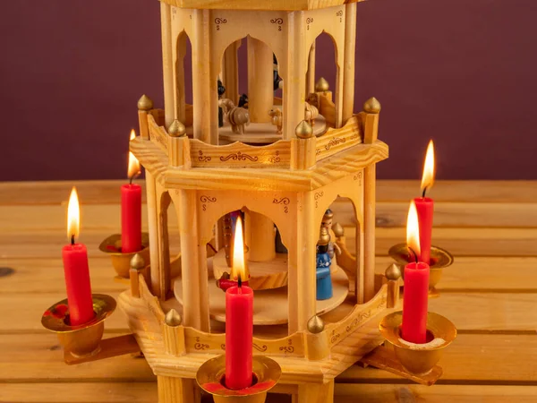 Christmas pyramid. Christmas carols, singers in the form of wooden figures. Christmas carousel.