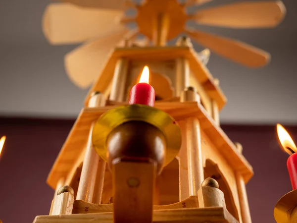 Christmas pyramid. Christmas carols, singers in the form of wooden figures. Christmas carousel.