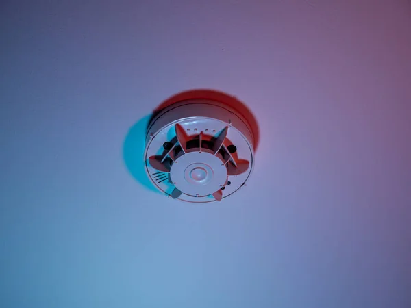 Smoke detector or fire alarm system on the ceiling. close-up.