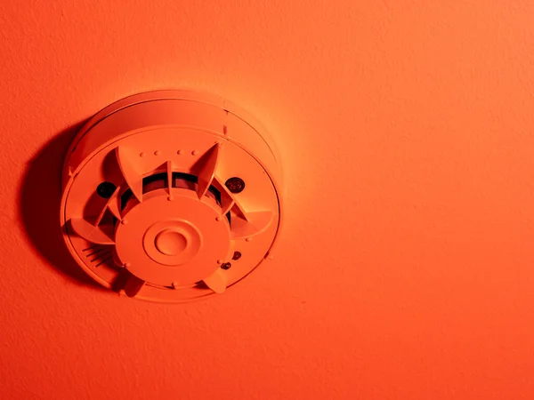 Smoke detector or fire alarm system on the ceiling. close-up.