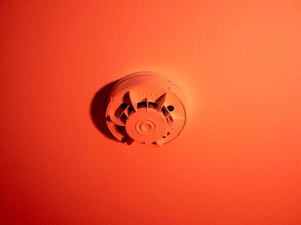 Smoke detector or fire alarm system on the ceiling. close-up.