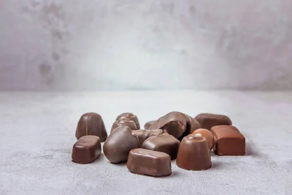 Chocolate candies in bulk of different shapes — Stock Photo, Image