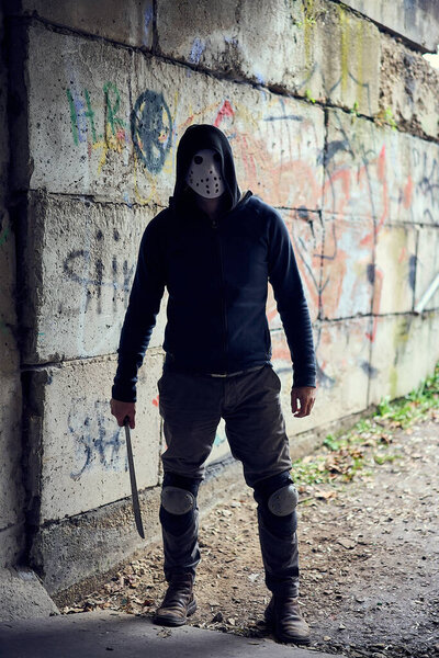 Serial killer Jason Voorhees in hockey mask. Friday 13th cosplay costume. 