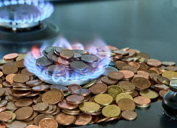Euro metal coins burning in the gas