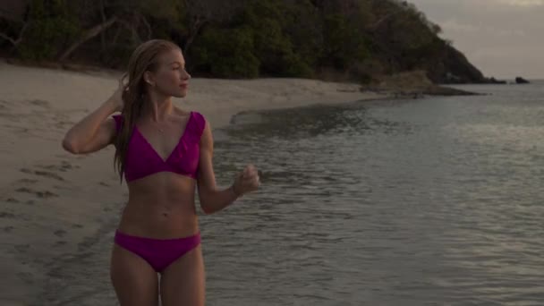Slow Motion Tracking Shot Woman Walking Beach Sunset Anse Roche — стоковое видео