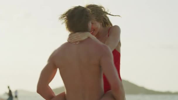 Slow Motion Low Angle Close Man Carrying Woman Spinning Beach — Wideo stockowe