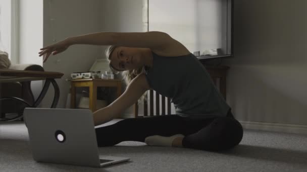 Girl Sitting Floor Watching Instructional Yoga Video Laptop Stretching Provo — Stock videók