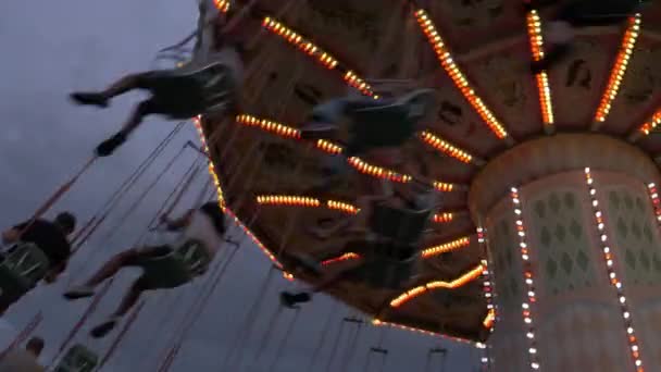 Low Angle View People Riding Chain Swing Ride Amusement Park Videoclip