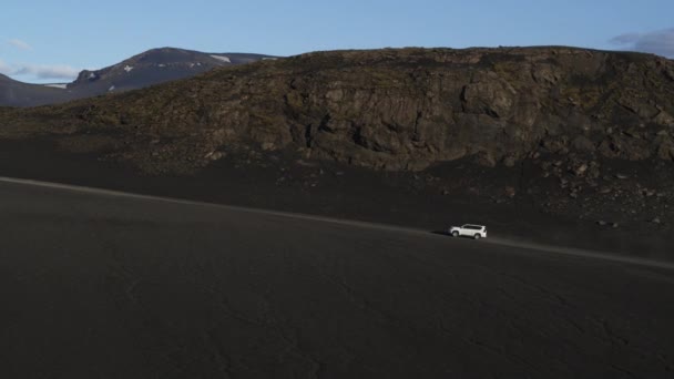 Aerial Tracking Shot Car Driving Hill Remote Landscape Highlands Iceland — Stock Video