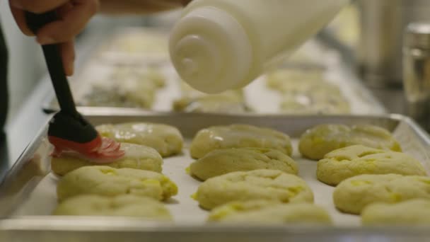 Close Panning Shot Baker Brushing Cookies Icing Salt Lake City — Stock video