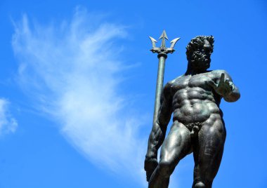 BOLOGNA ITALY - 05 28 2019: The Fountain of Neptune (Italian: Fontana di Nettuno) is a monumental civic fountain located in the eponymous square, Piazza del Nettuno, next to Piazza Maggiore