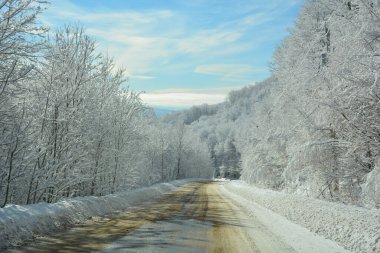 Winter landscape road in Bromont mountain, Eastern township Quebec, Canada clipart
