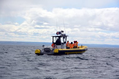 BAIE SAINTE CATHERINE QUEBEC CANADA 08 26 2020: Whales watching zodiac in Saint Lawrence river