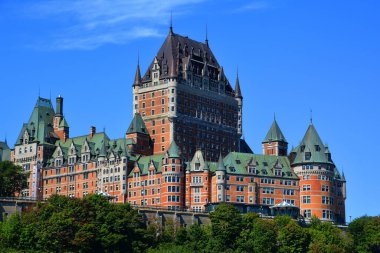 QUEBEC CITY CANADA 08 19 20: Chateau Frontenac is a grand hotel. It was designated a National Historic Site of Canada in 1980, generally recognized as the most photographed hotel in the world clipart