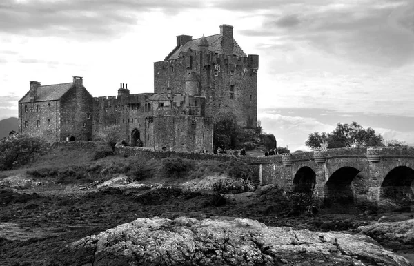 Eilean Donan castle on a cloudy day. low tide. Highlands, Scotland. UK