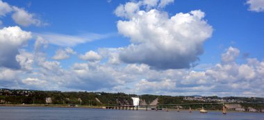 QUEBEC CANADA 08 24 2020: Ile d'orlean bridge and Montmorency Falls is a large waterfall on the Montmorency The falls are located on the boundary between the borough of Beauport, and Boischatel