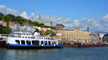 QUEBEC CITY CANADA 08 19 20: Ferry and Chateau Frontenac is a grand hotel. It was designated a National Historic Site of Canada , generally recognized as the most photographed hotel in the world