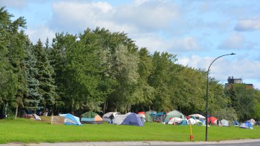 MONTREAL QUEBEC, CANADA - 09.12.2020: Residents of Montreal homeless shelters. A group of about 50 people who have been living in tents along Montreal's Notre-Dame Street are refusing to leave