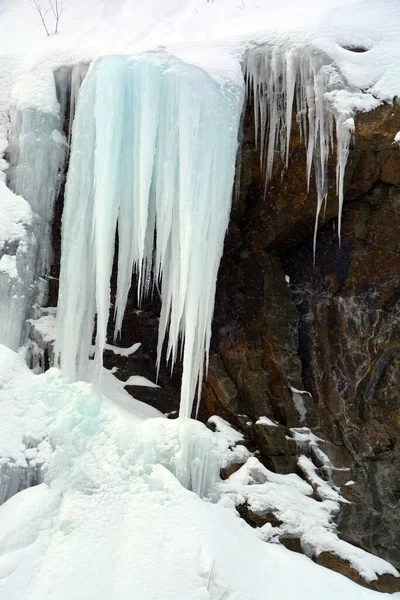 icicles on rock, winter landscape