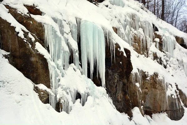 icicles on rock, winter landscape