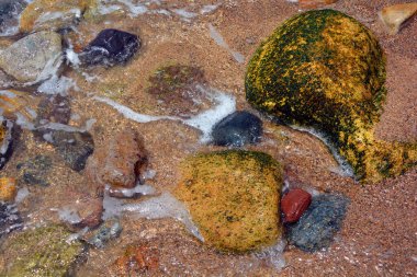 close-up shot of beautiful pebbles on seashore