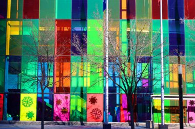 MONTREAL QUEBEC CANADA 12 13 2021: Colorful windows of the Palais des congres de Montreal is a convention centre in Montreal's Quartier international at the north end of Old Montreal.