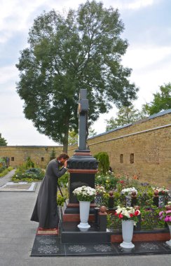 KIEV UKRAINE 09 03 17: Monk praying in Kiev Pechersk Lavra, Kyiv Pechersk Lavra or Kiev Monastery of the Caves, is a historic Orthodox Christian monastery