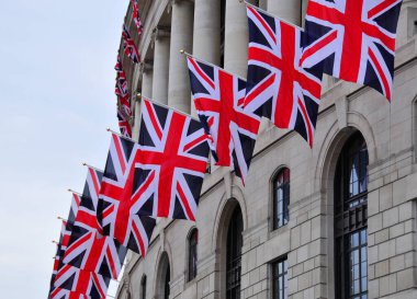 flags of the united kingdom hanging on building
