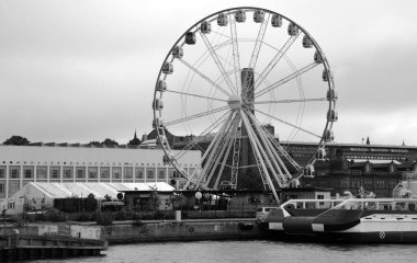 HELSINKI, FINLAND SEPTEMBER 25 2015: Market Square (Kauppatori) and Finnair skywheel in central square in Helsinki and one of most famous market places and tourist attractions. Located in South Harbor