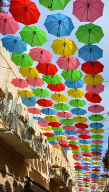 JERUSALEM ISRAEL 26 11 16: rows of colorful umbrellas over street in Israel