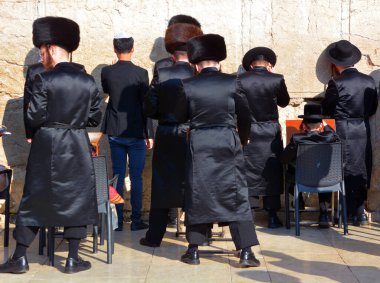 JERUSALEM ISRAEL 26 10 16: Jewish hasidic men pray a the Western Wall, Wailing Wall the Place of Weeping is an ancient limestone wall in the Old City of Jerusalem. Second Jewish Temple by Herod the Great
