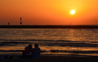 Sunset over Tel Aviv Israel ocean beach.