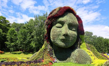 Mosaiculture 'daki kız heykeli Bir Zamanlar Dünyası' nda sergi, gezegenimizdeki yaşamın güzelliği için bir ilahi olacak.