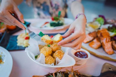 Picture of deep fried cheese balls or croquettes on dinner table