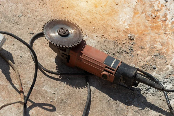 Close up Angle grinder with sanding discs on Concrete floor grinder