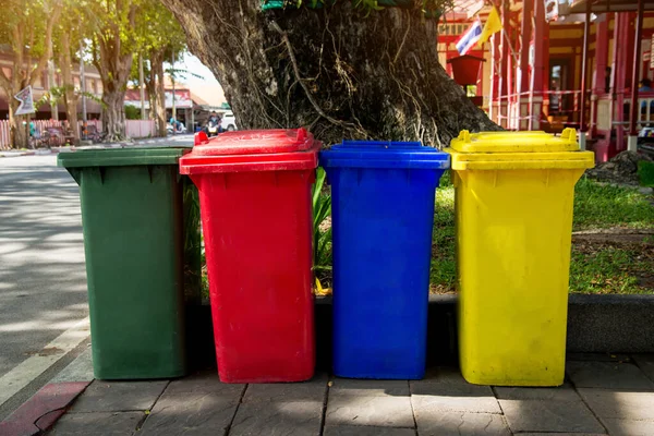 Multi-colored plastic garbage containers for different garbage