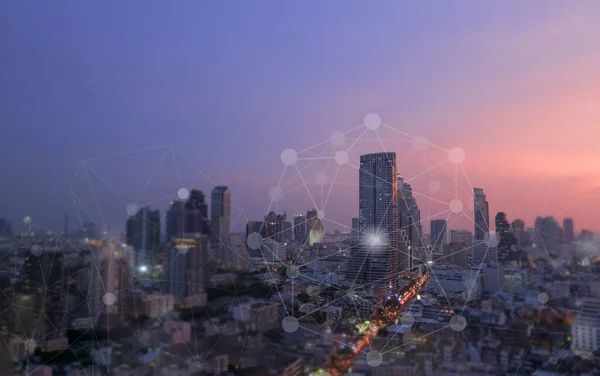 Networking connect technology abstract concept. Polygonal with connecting dots with city business twilight background.