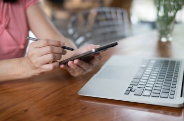 Internet of things. people using a mobile phone and laptop computer with internet go to the web.