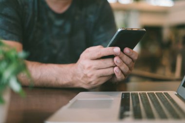 Internet of things. people using a mobile phone and laptop computer with internet go to the web.