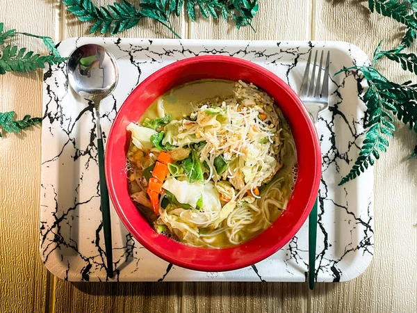 Flat lay view of traditional russian dish with chicken and vegetables