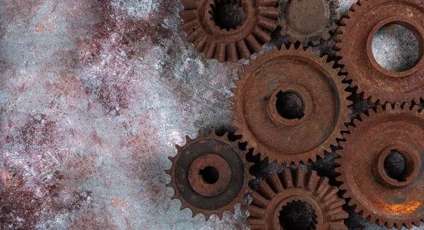 Old rusty metal gears on a rusty textural background Stock Image